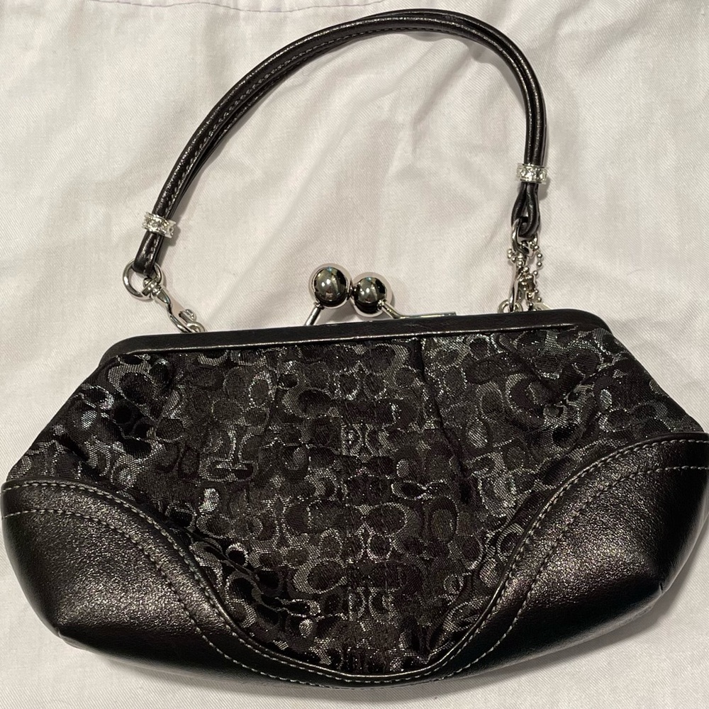 Coach clutch with storage pouch H05J-3597